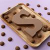 Chocoladeletter S karamel / toffee (200 gram) met kruidnoten