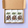 Geopend welkomst geschenkpakket met drie zakjes chocolade