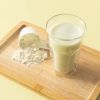 Whey proteïne milkshake pistache met een glas