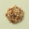Havermuesli pecan & hazelnoot op een lichtgroene achtergrond
